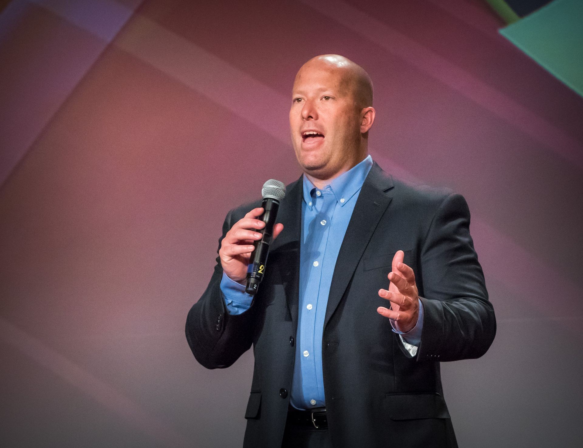 Charles Burke speaking at a power under training event about leadership, communication, and sales training. Helping executives become better leaders